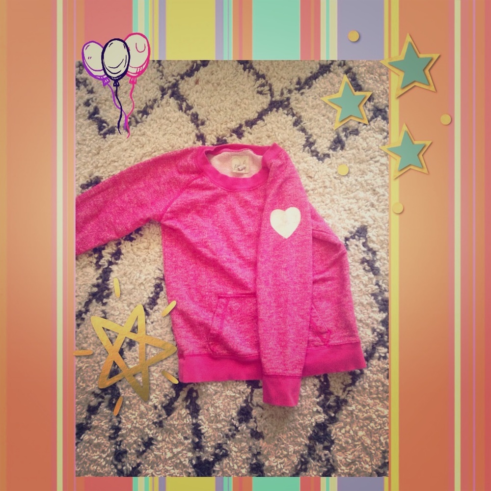 Pink sweatshirt with white heart on sleeve